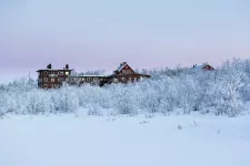 Exterior view of buildings in a winter landscape. Photo.