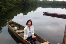 Terese Thoni sitting in a small boat. Photo.